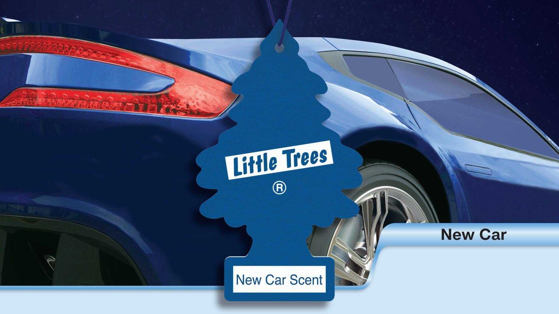 A blue Little Trees air freshener hanging from a car mirror.